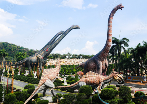Fototapeta Naklejka Na Ścianę i Meble -  Beautiful Dinosaurs statue in forest gardens outdoor 