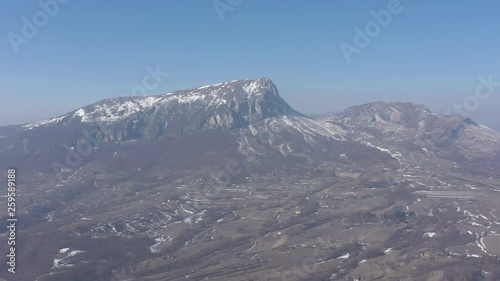 Mountain Stol peak snowed under the blue sky 4K drone video photo