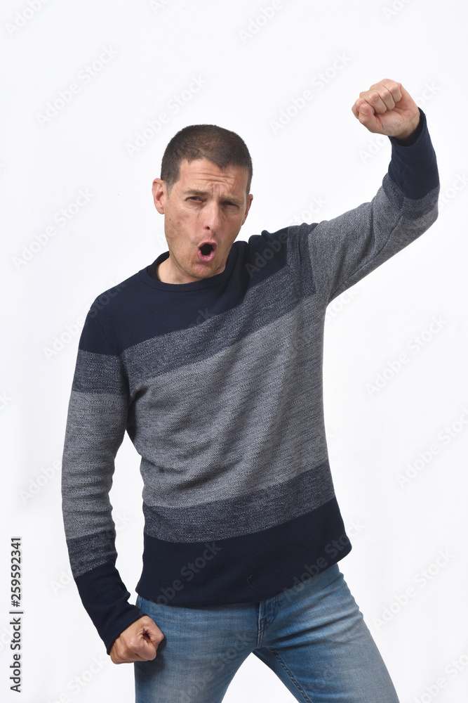 man raising her arms and smiling in victory sign on white background man raising her arms and smiling in victory sign on white background
