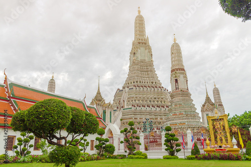 Wat Arun Temple big pagoda statue symbols buddhism religion in Bangkok Thailand