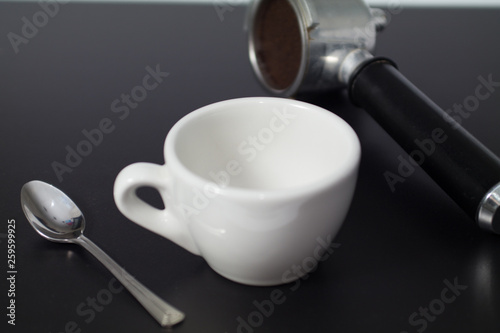 aromatic black coffee and coffee spoon on the table