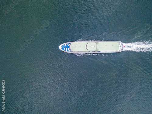 Aerial view of passenger ferry ship cruising on a lake in Switzerland.