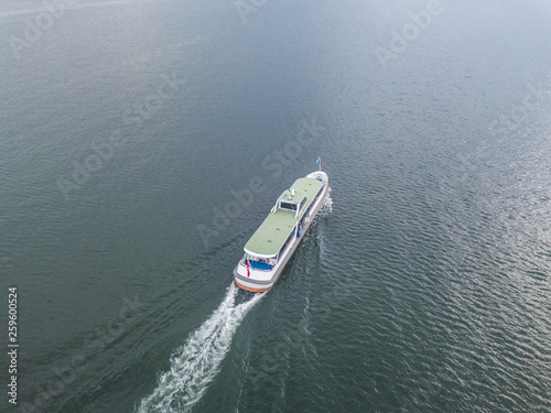 Aerial view of passenger ferry ship cruising on a lake in Switzerland. © Mario