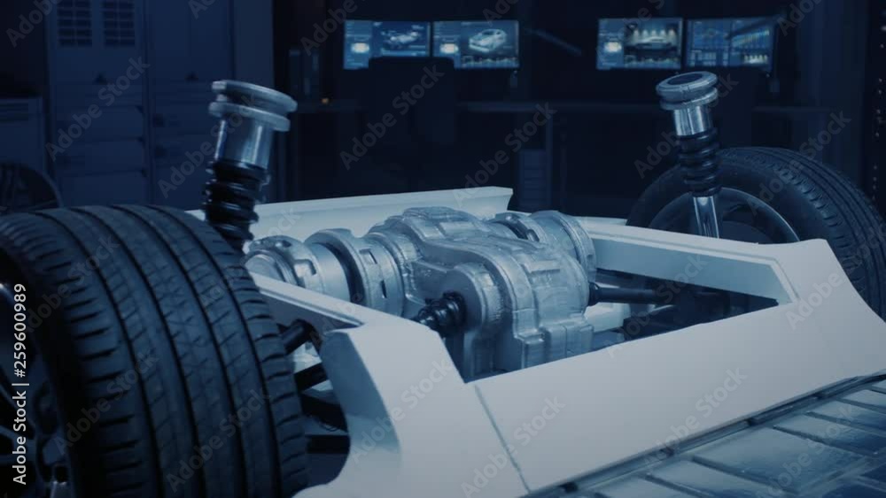 Automobile Concept: Authentic Electric Car Platform Chassis. Hybrid Frame Include: Wheels ,Engine, Brakes and Battery. In Innovative Automotive Design Facility. Focus on Axel and Engine