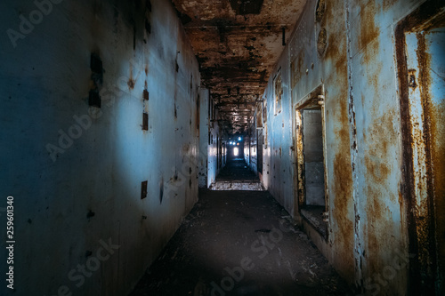 Dark creepy corridor in abandoned nuclear power plant in Crimea. First person view, going with flashlight in dirty grunge tunnel in ruined building, horror escape