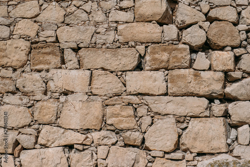 Old stone wall texture, blocks of ancient castle surface as background for design