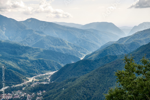 The gorge among the mountains with green slopes. © Dmitrii Potashkin