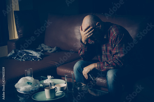 Drunk man on the sofa. Alcoholism, alcohol addiction, drug addic