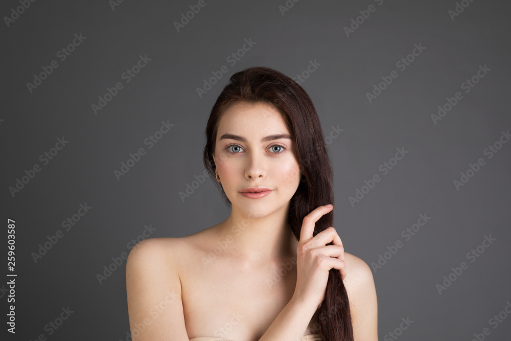Confident good-looking beautiful woman with brunette hair with healthy pure skin Confident good-looking beautiful woman with brunette hair with healthy pure skin