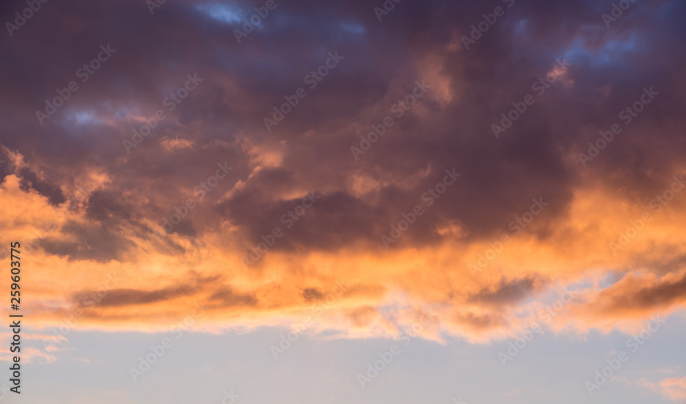 Dark dramatic multicolored clouds during the sunset_