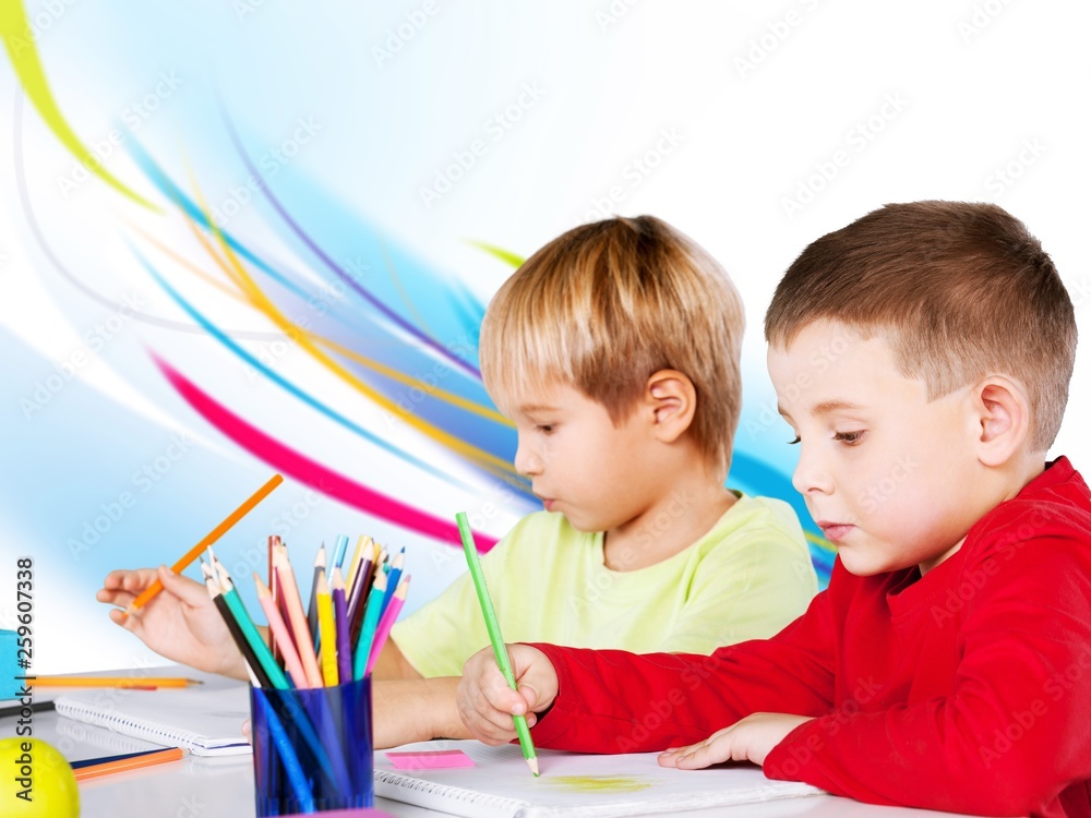 Two little boys studying subject on background Two little boys studying subject on background