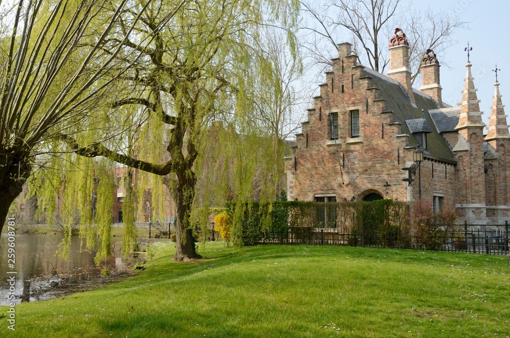 Brick building in garden in Brugge, Belgium Brick building in garden in Brugge, Belgium