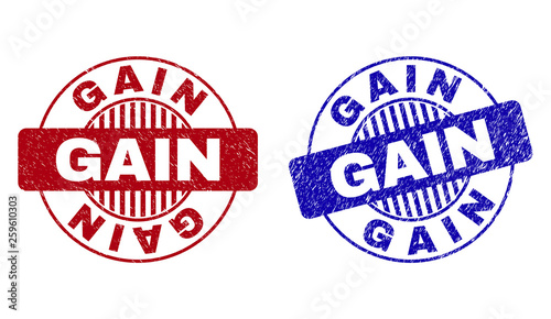 Grunge GAIN round stamp seals isolated on a white background. Round seals with grunge texture in red and blue colors. Vector rubber imprint of GAIN label inside circle form with stripes.