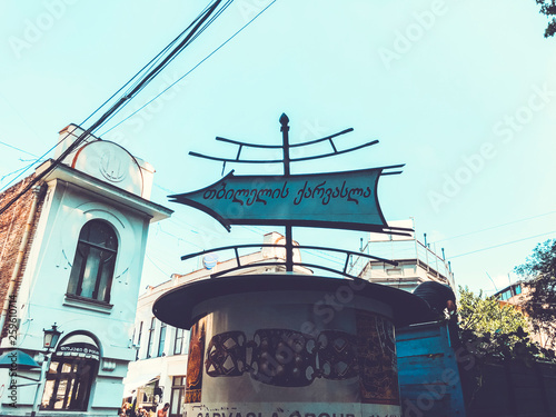 TBILISI, GEORGIA - July 10, 2018: The big column on the Shardeni street in old Tbilisi to announce some event in the capital  photo