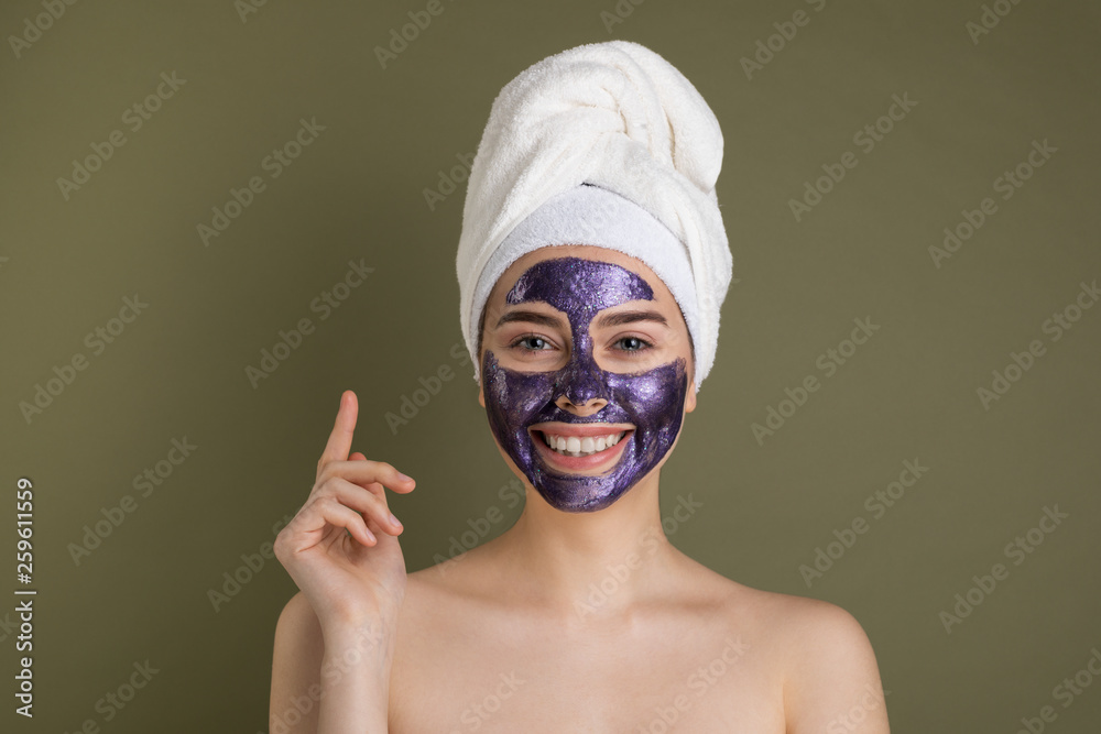 Young smiling european woman taking care of her face skin Young smiling european woman taking care of her face skin