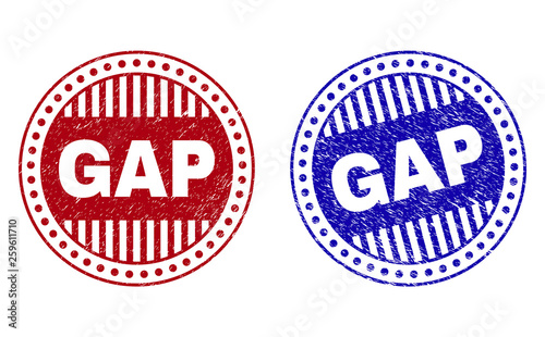 Grunge GAP round stamp seals isolated on a white background. Round seals with grunge texture in red and blue colors. Vector rubber imprint of GAP tag inside circle form with stripes.