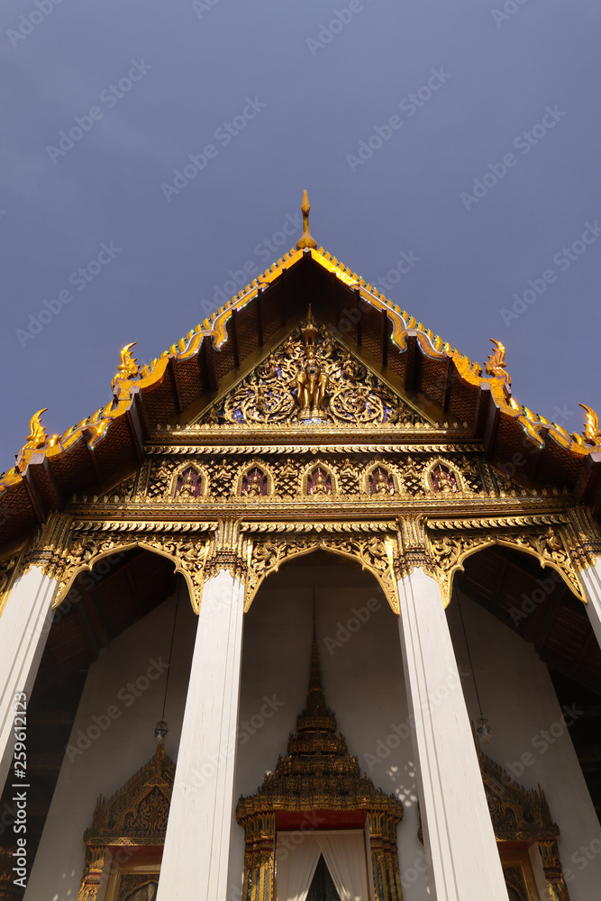 Naklejka premium Wat Phra Kaew, commonly known in English as the Temple of the Emerald Buddha or grand palace is regarded as the most sacred Buddhist temple in Thailand