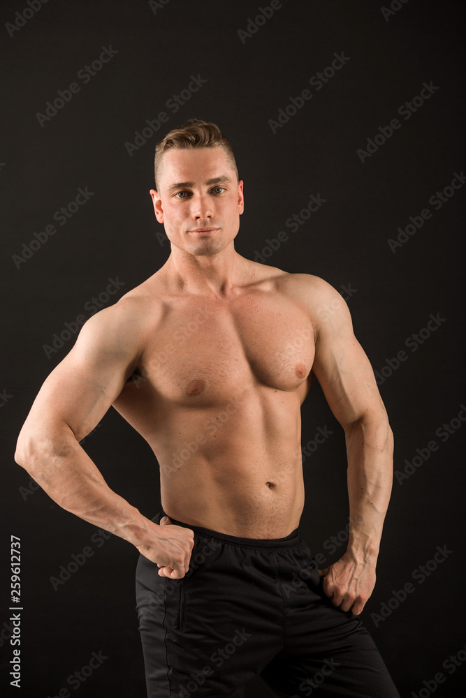 Fototapeta premium handsome muscular man on black background