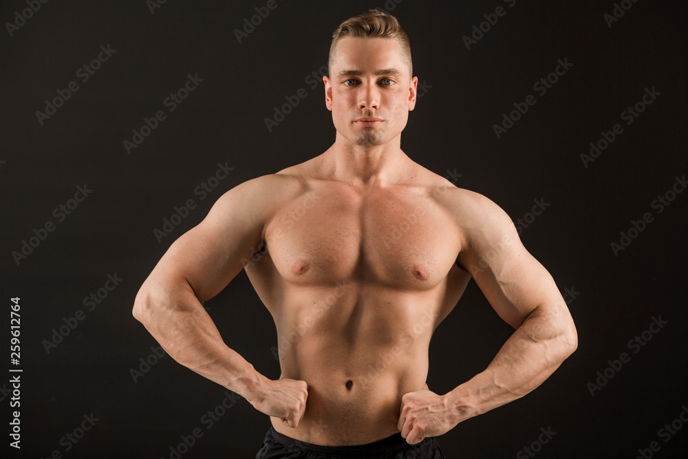 Fototapeta premium handsome muscular man on black background