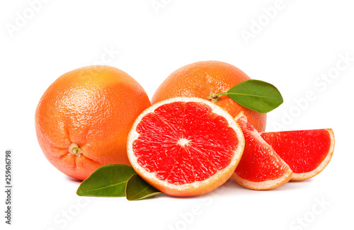 Whole and cut ripe grapefruits isolated on white