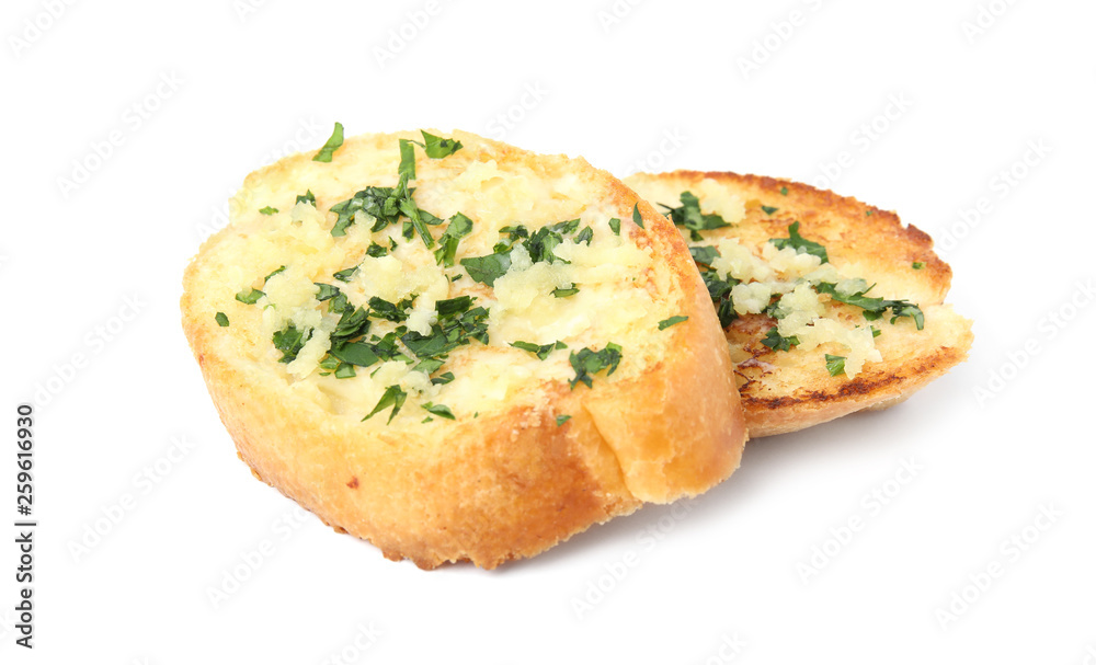 Slices of tasty garlic bread with herbs isolated on white Slices of tasty garlic bread with herbs isolated on white