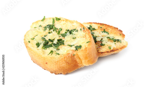 Slices of tasty garlic bread with herbs isolated on white