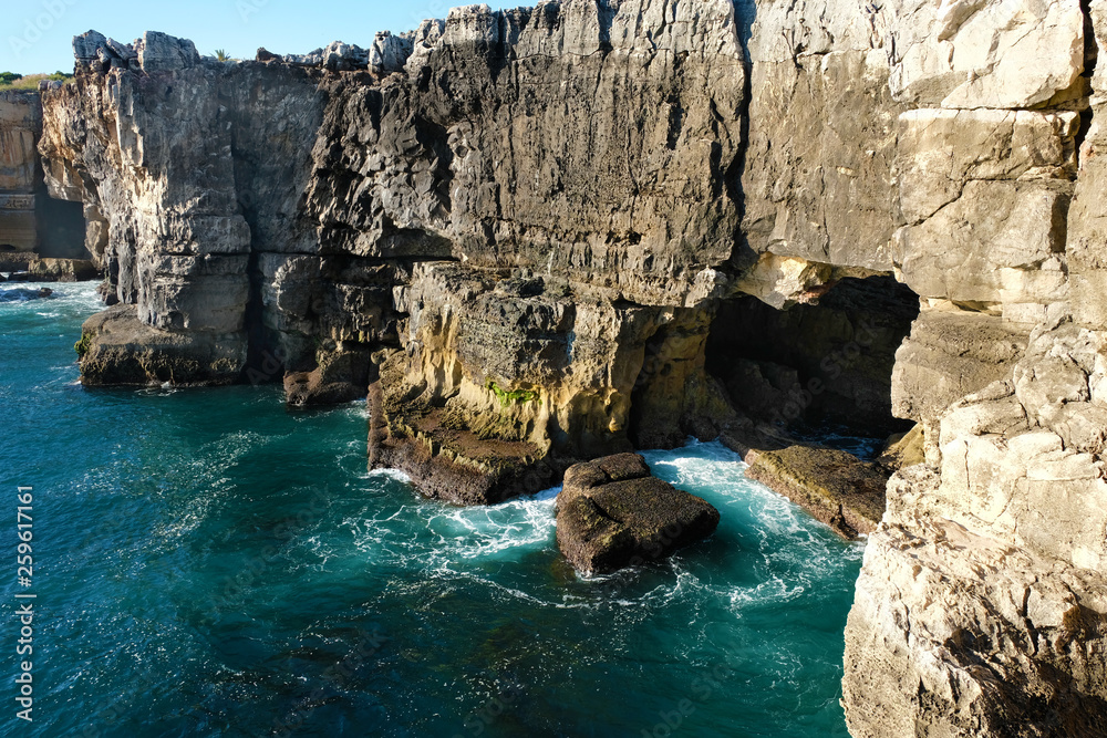 Cave in the rocks near the water in the town of Cascais Portugal on the shores of the Atlantic Ocean