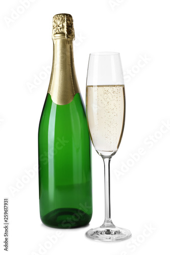 Bottle and glass with champagne on white background. Festive drink