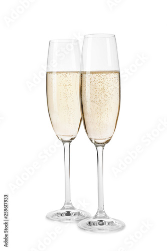 Glasses of champagne on white background. Festive drink