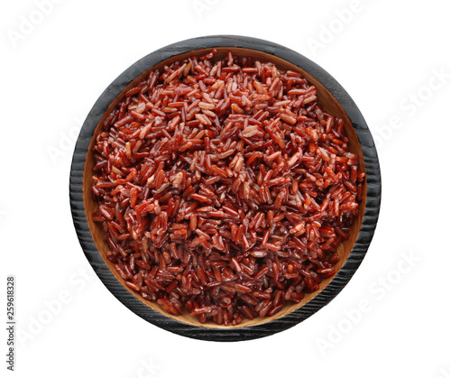 Bowl of cooked brown rice isolated on white  top view