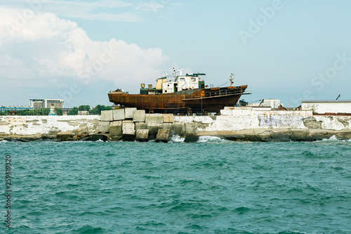 Fototapeta Naklejka Na Ścianę i Meble -  Old rusty ship in the shipyard, sea port of Anapa, Russia, Krasnodar region