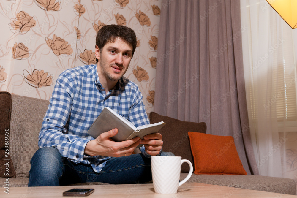 A man makes notes in a notebook. Making plans A man makes notes in a notebook. Making plans