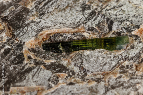 Macro stone tourmaline mineral on a black background