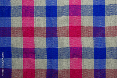Loincloth natural cotton textile with pink, white and blue square grid pattern.
