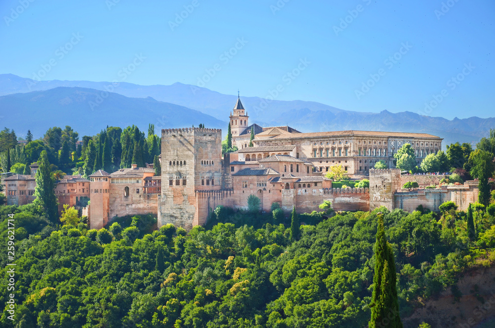 Amazing view of Alhambra palace complex in Granada, Spain taken on a sunny day. UNESCO World Heritage Site, significant sample of Islamic architecture and one of Spain's major tourist attractions.