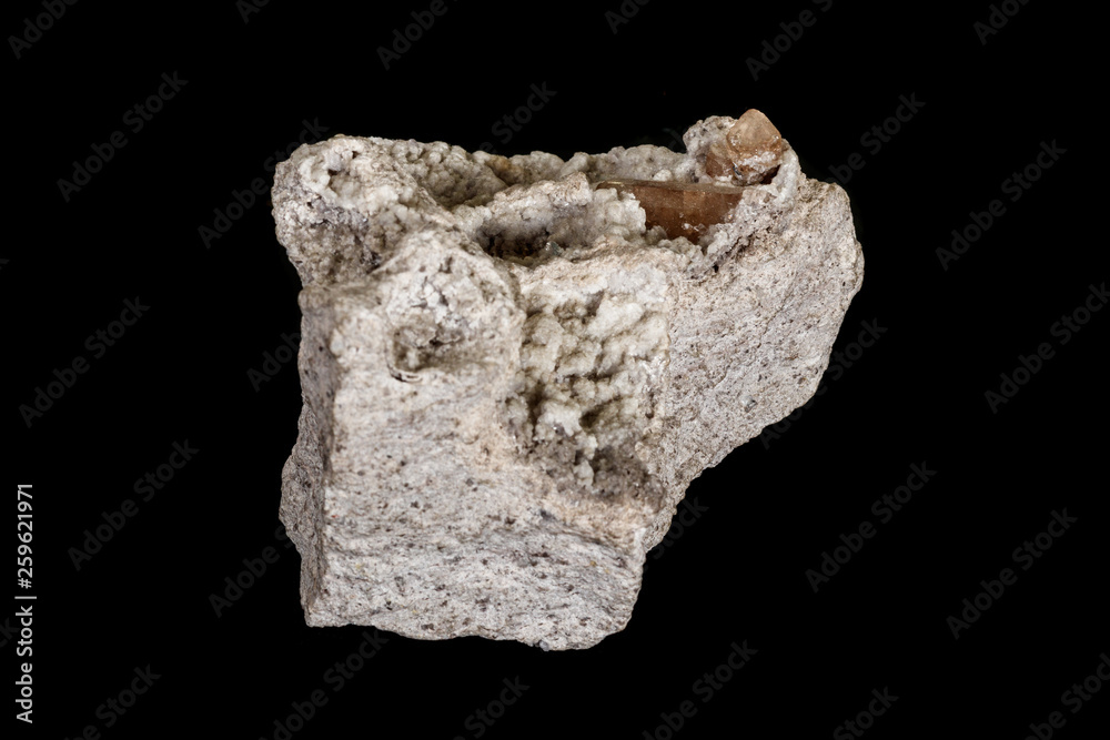 Macro stone Topaz mineral in rock on a black background Macro stone Topaz mineral in rock on a black background