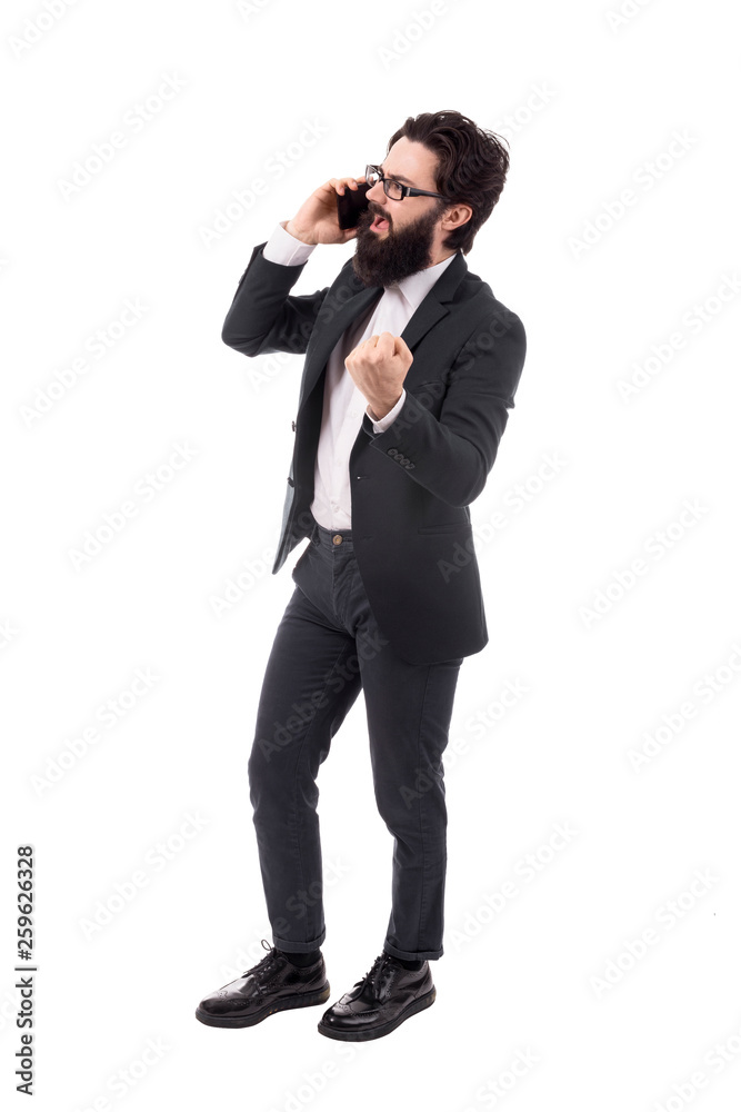 Full length portrait of a aggressive bearded businessman swears on the smartphone, isolated on white background Full length portrait of a aggressive bearded businessman swears on the smartphone, isolated on white background