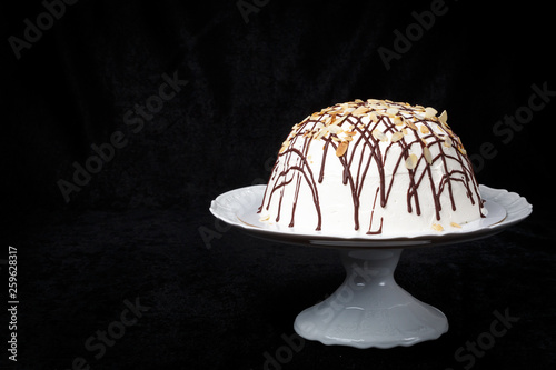 Handmade Pancho cake on black background. Front horizontal view with space for your text. photo