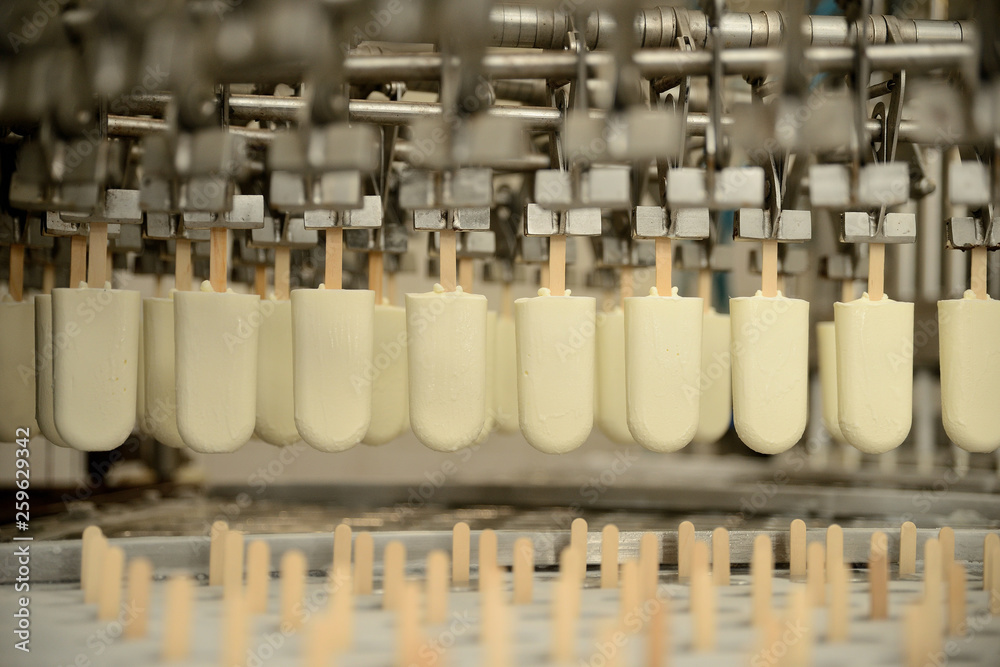 The conveyor automatic lines for the production of ice cream. Production of ice-cream at milk factory The conveyor automatic lines for the production of ice cream. Production of ice-cream at milk factory