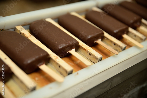 The conveyor automatic lines for the production of ice cream. Production of ice-cream at milk factory