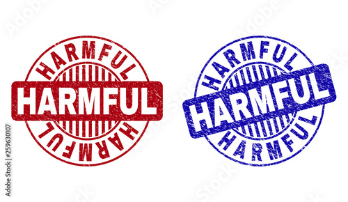 Grunge HARMFUL round stamp seals isolated on a white background. Round seals with distress texture in red and blue colors. Vector rubber imitation of HARMFUL tag inside circle form with stripes.