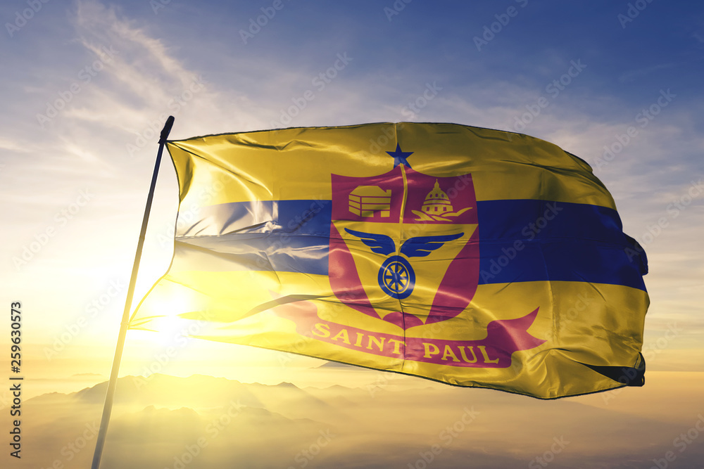 Saint Paul city capital of Minnesota flag waving on the top sunrise mist fog