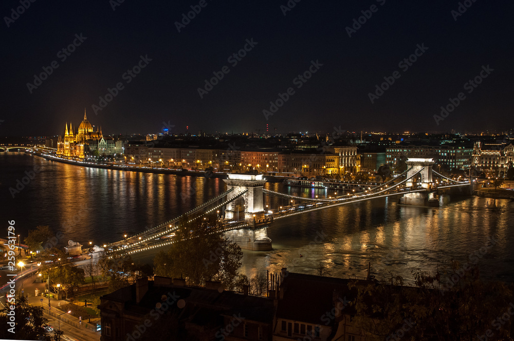 Evening view of Budapest city skyline, Danube river and chain bridge