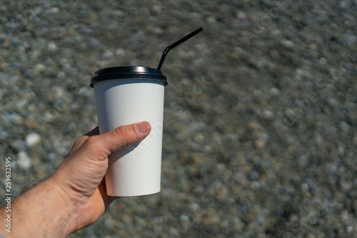 Fototapeta Naklejka Na Ścianę i Meble -  hand holding cup of coffee