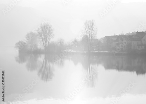 Misty view across the river Mosel in Zell Germany