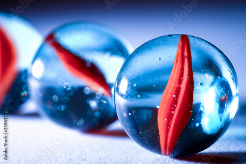 Glass marbles with shallow depth of field and a filter applied photo