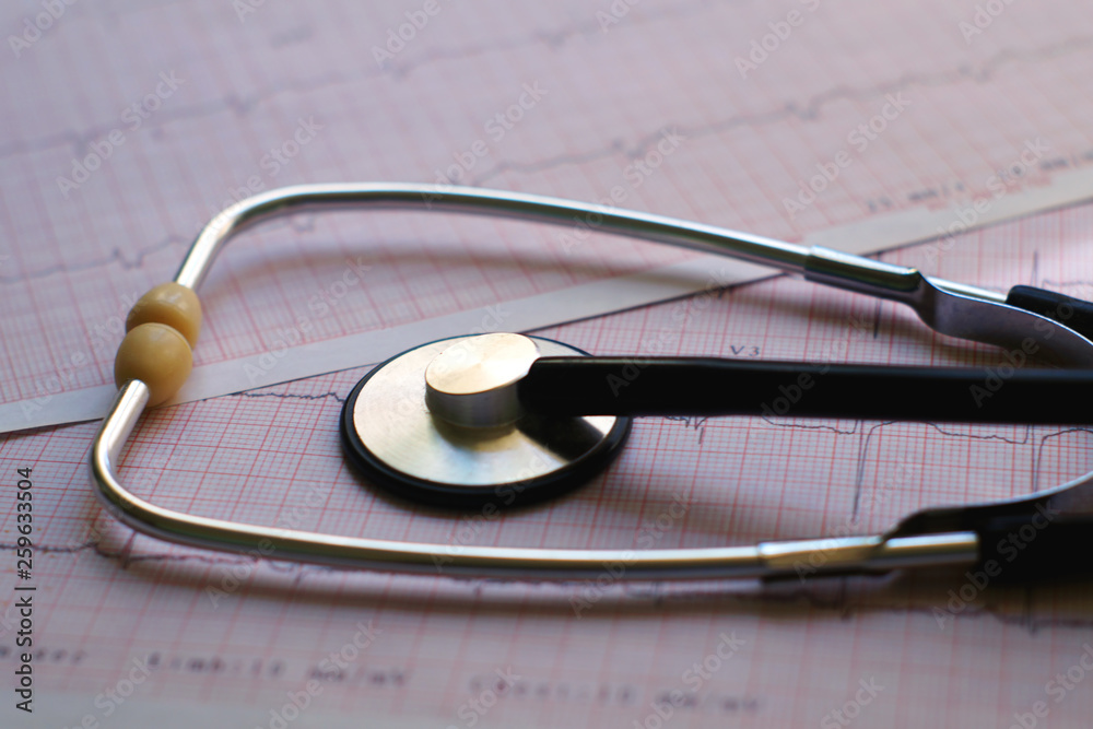 ECG results and Phonendoscope on the table.
