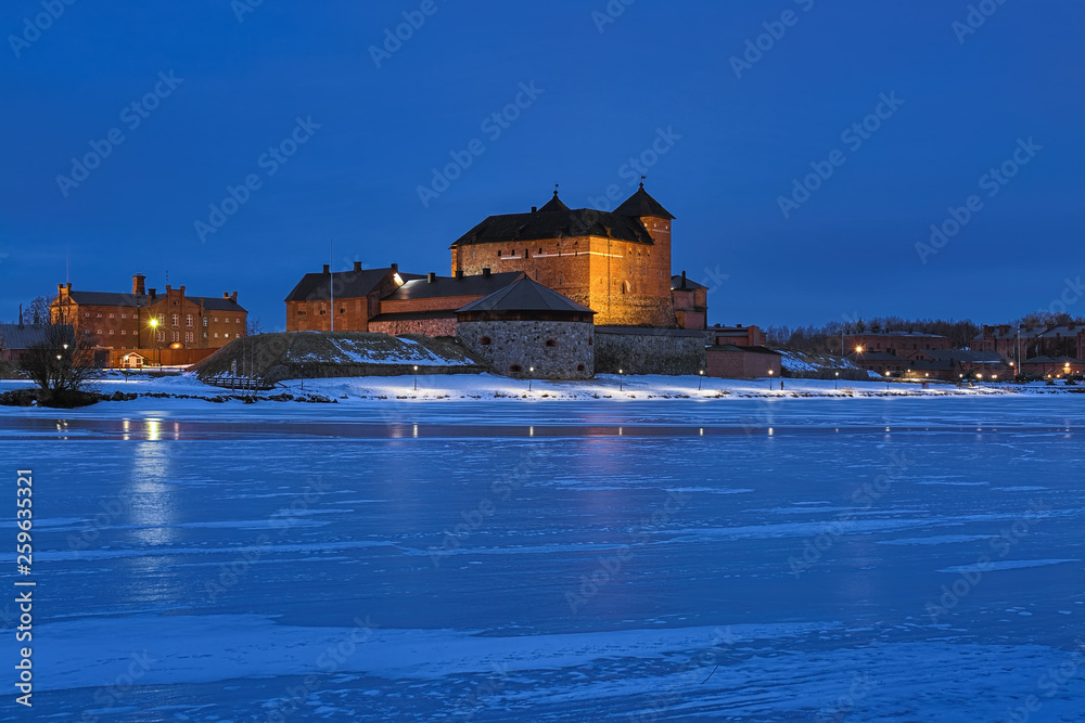 Hameenlinna, Finland. Hame Castle or Tavastia Castle in winter dusk. The castle was constructed in the 13th century.
