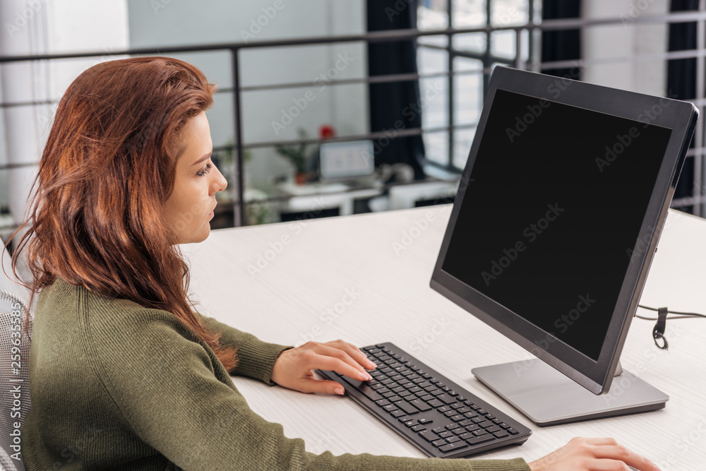 confident woman using computer at workplace in office confident woman using computer at workplace in office