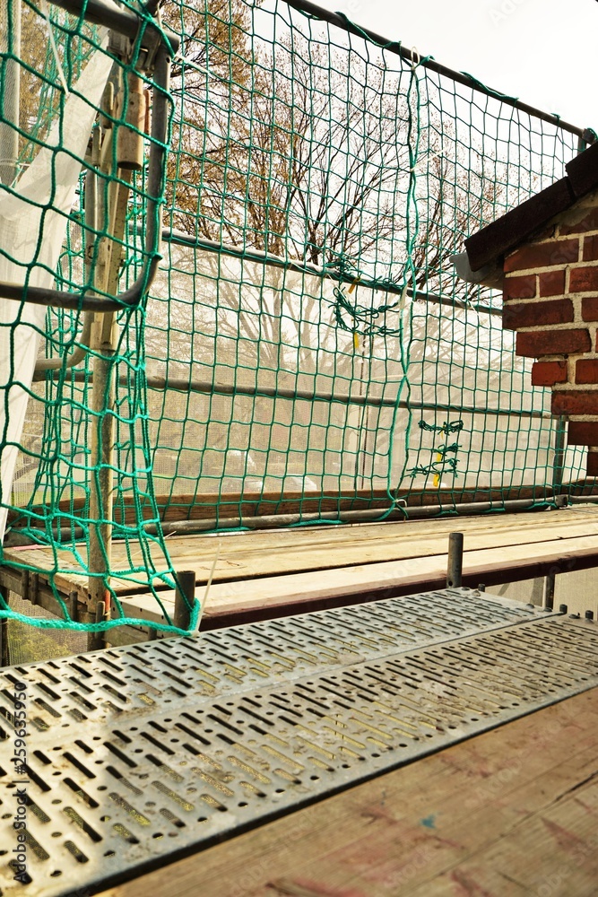 Fototapeta premium Scaffolding on a house wall